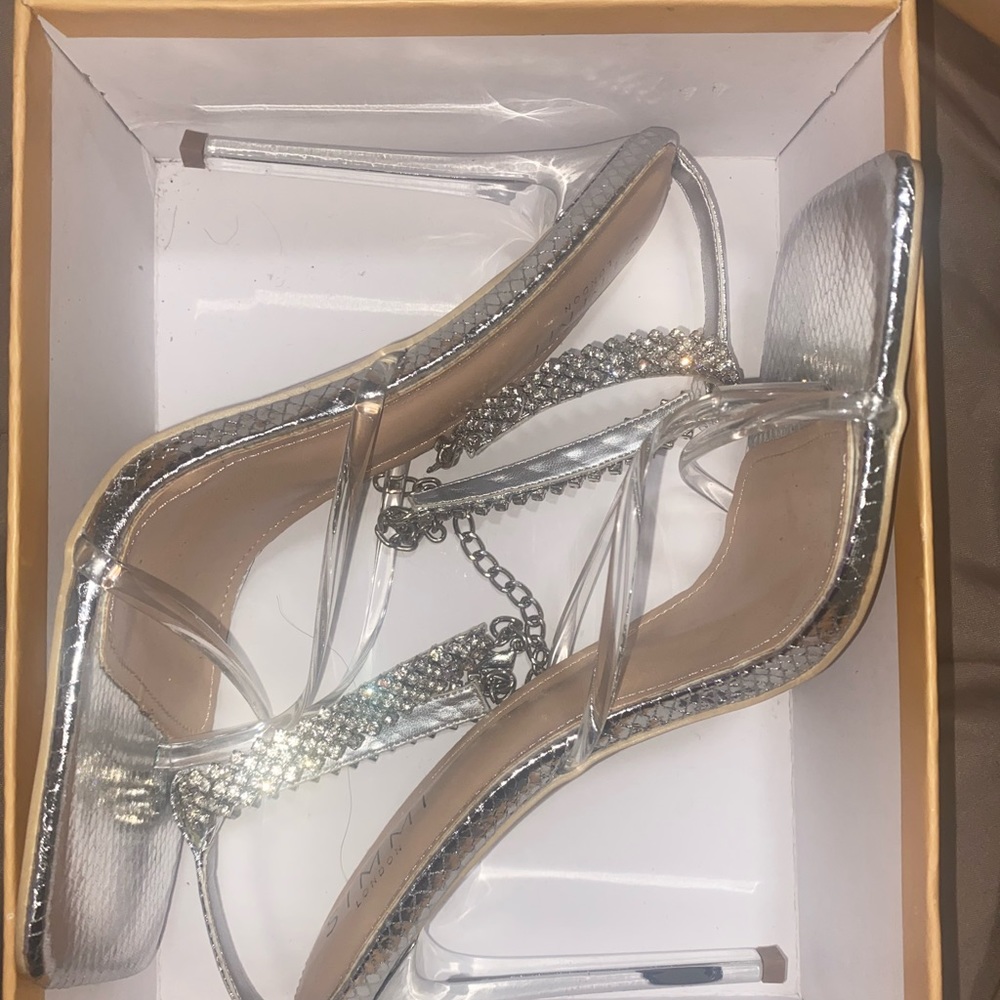 Bedazzled snakeskin silver heels